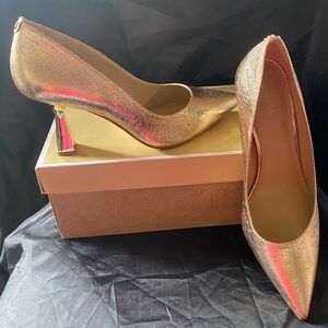 1 pair of Michael Kors Gold shoes. Never worn